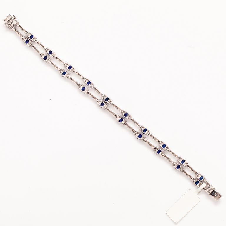 ARMBAND, 18K vitguld, saffirer ca 5.07 ct tot och diamanter ca 3.52 ct tot.
