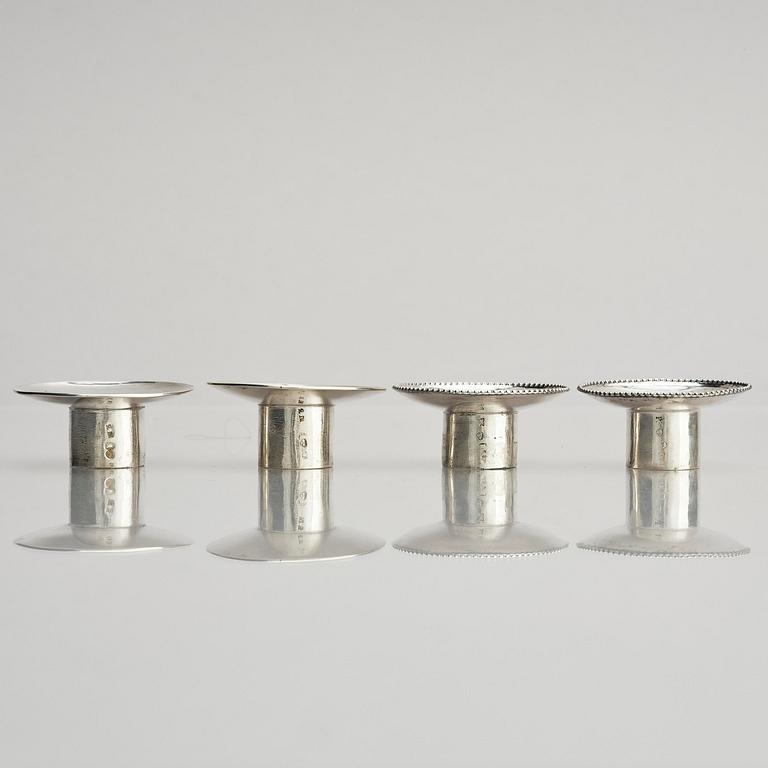 Two pair of early 19th century silver candlesticks, marks of Anders Lundqvist, Stockholm, Sweden 1819 and 1821.