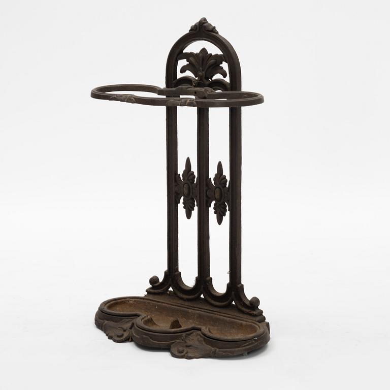 A cast iron umbrella stand, circa 1900.
