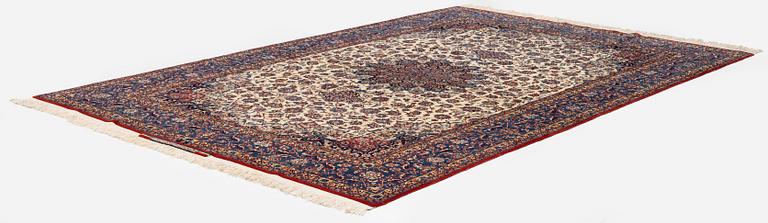 A semi-antique Isfahan carpet, Central Persia, signed (Ali) Seirafian, 328 x 250 cm.