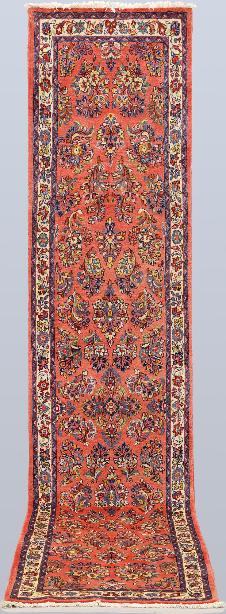 A Saruk runner carpet, 358 x 78 cm.