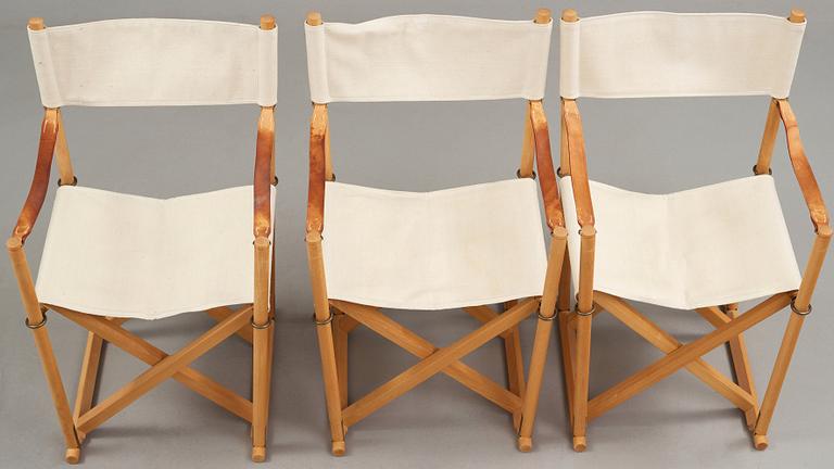 Mogens Koch, a set of six beech and canvas 'MK16' folding chairs, comes with a stand for storage, Rud Rasmussen, Denmark.