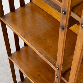An oak Revolving bookcase by Trübner & Co, England, early 20th century.