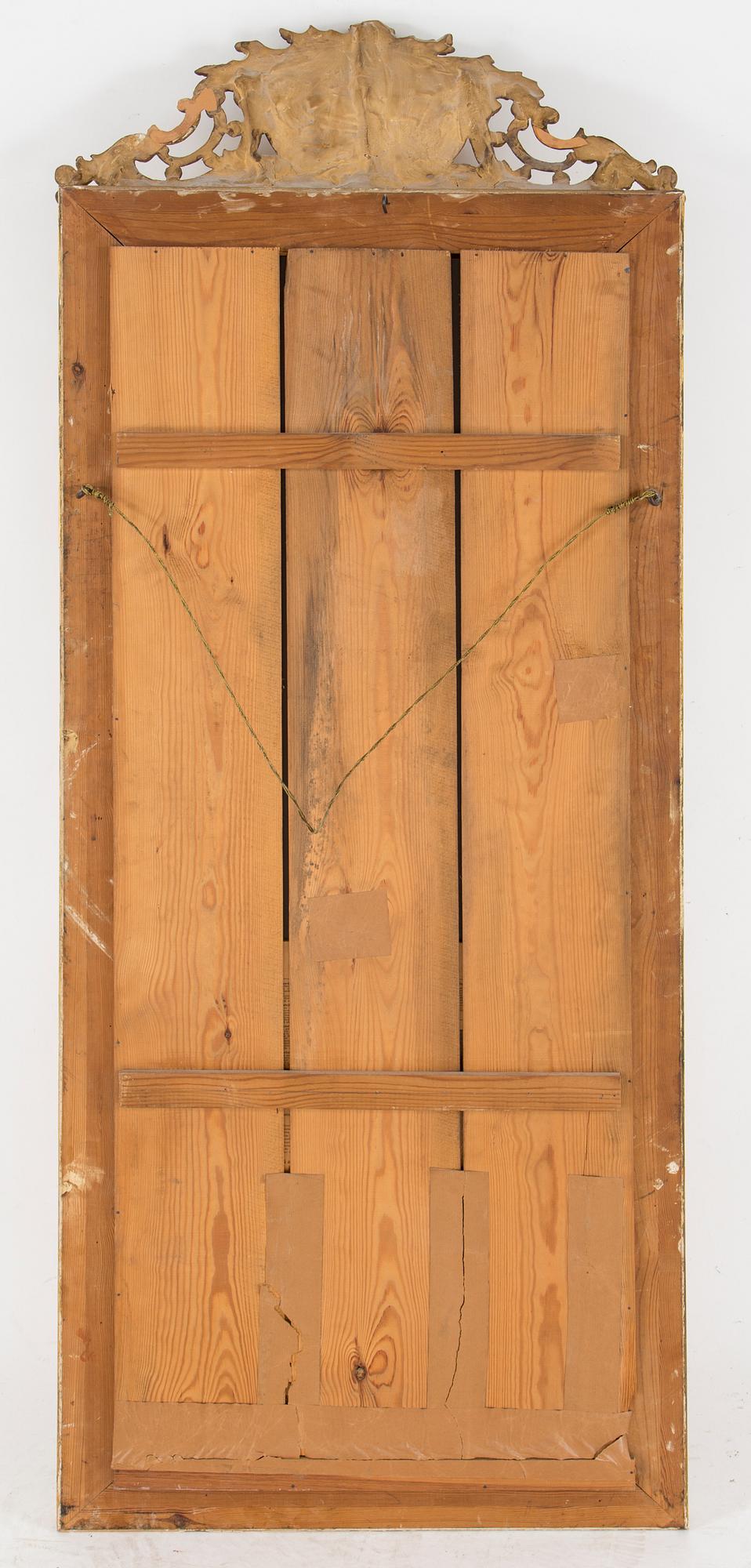 A Swedish Gustavian style mirror and console table with marble top from the first half of the 20th century.