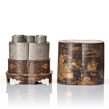 A Chinese lacquer box with a set of five pewter tea caddies, Qing dynasty, 18/19th Century.