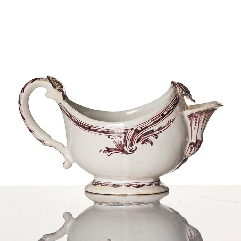 A Swedish Rörstrand faience sauce boat/creamer, 18th Century.