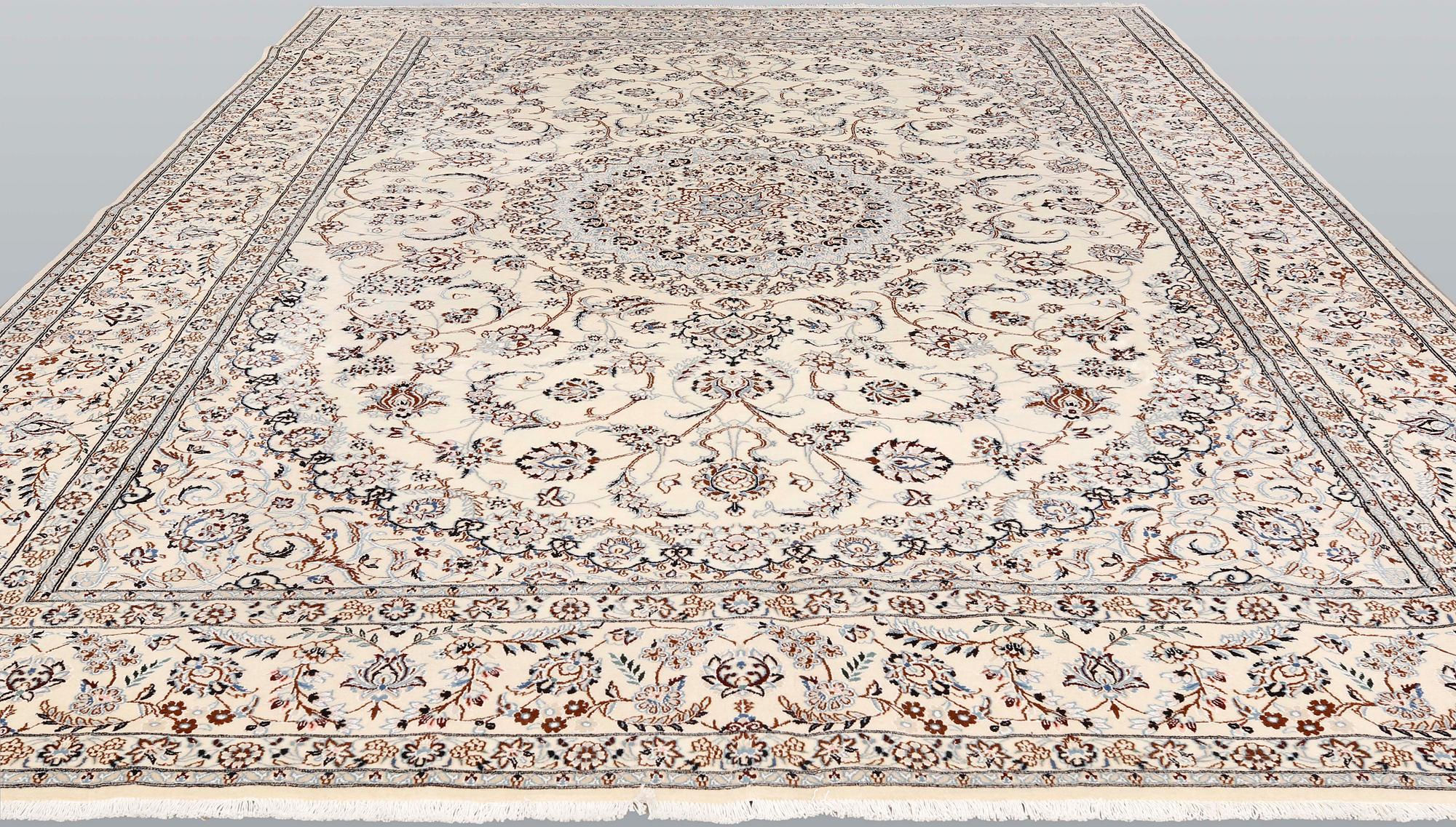 A Nain part-silk carpet, 395 x 293 cm.