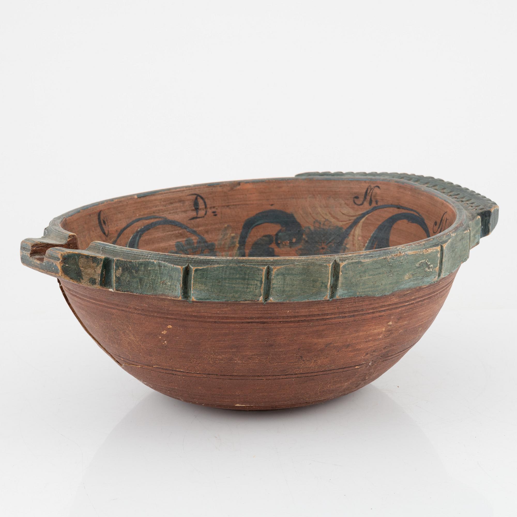 A lathed and painted bowl dated 1783.