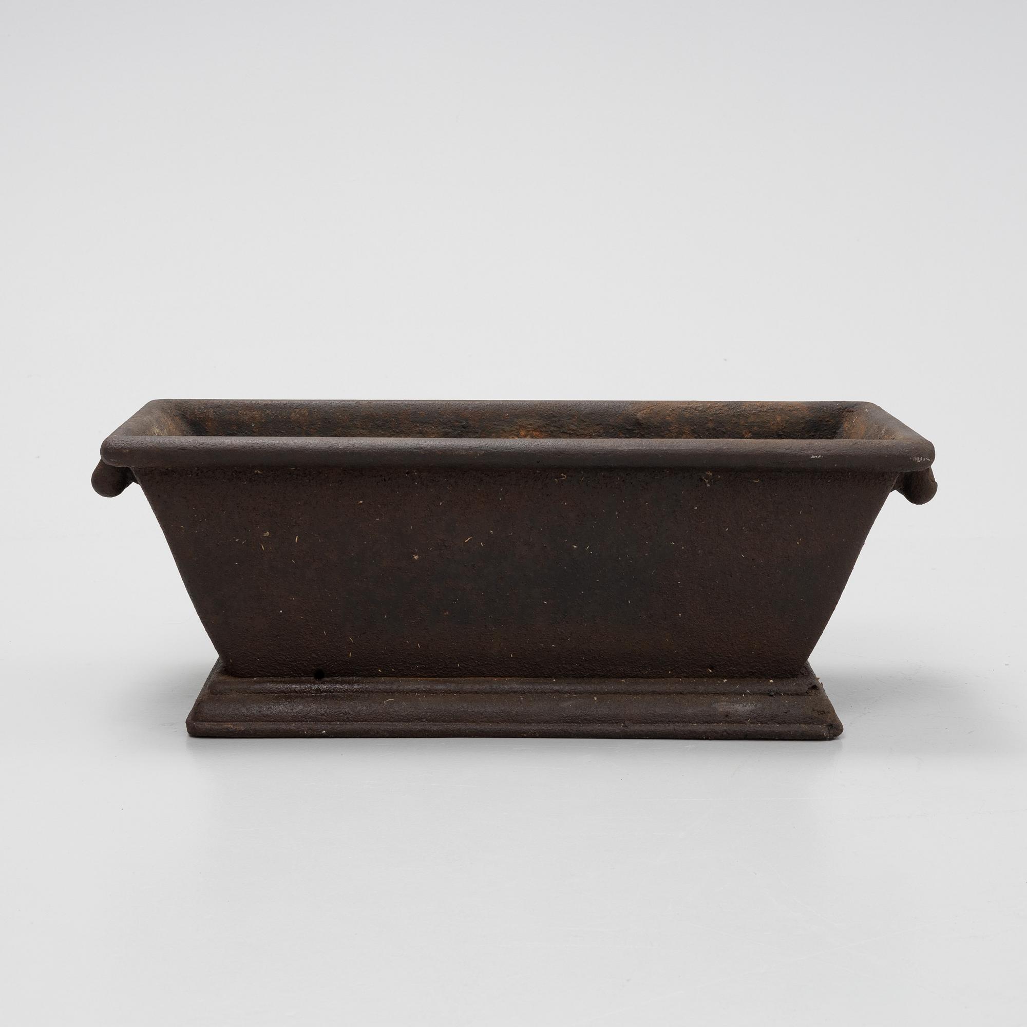 A cast iron plant pot, 20th Century.