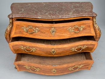 A ROCOCO CHEST OF DRAWERS.