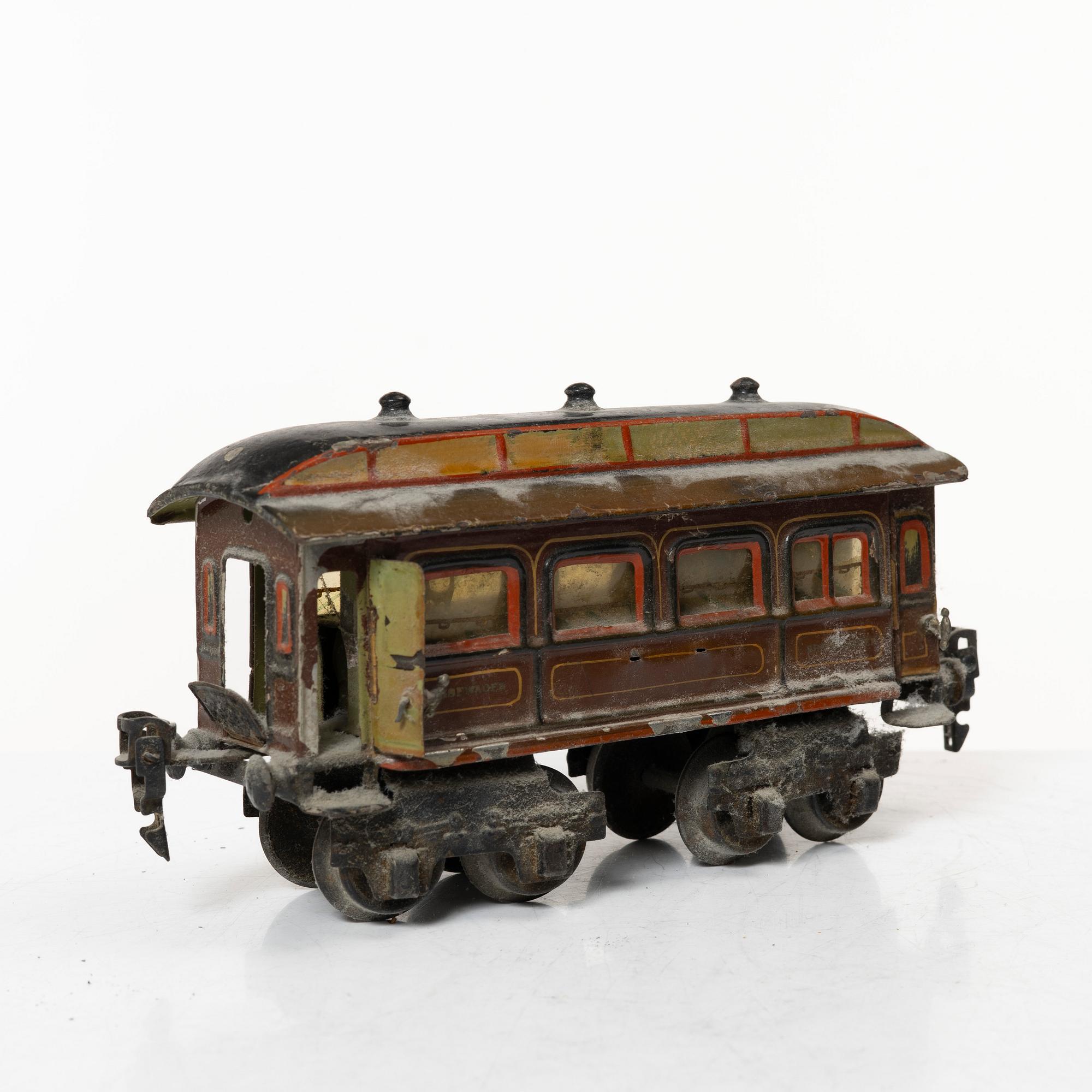 Model train with track and station building, 13 pieces, Germany, 1920s.