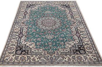 A Nain carpet, part silk, 6 laa, ca. 300 x 201 cm.