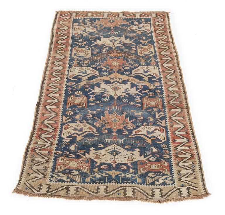An oriental rug, c. 200 x 115 cm.