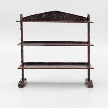A Chinese hardwood shelf, 20th century.