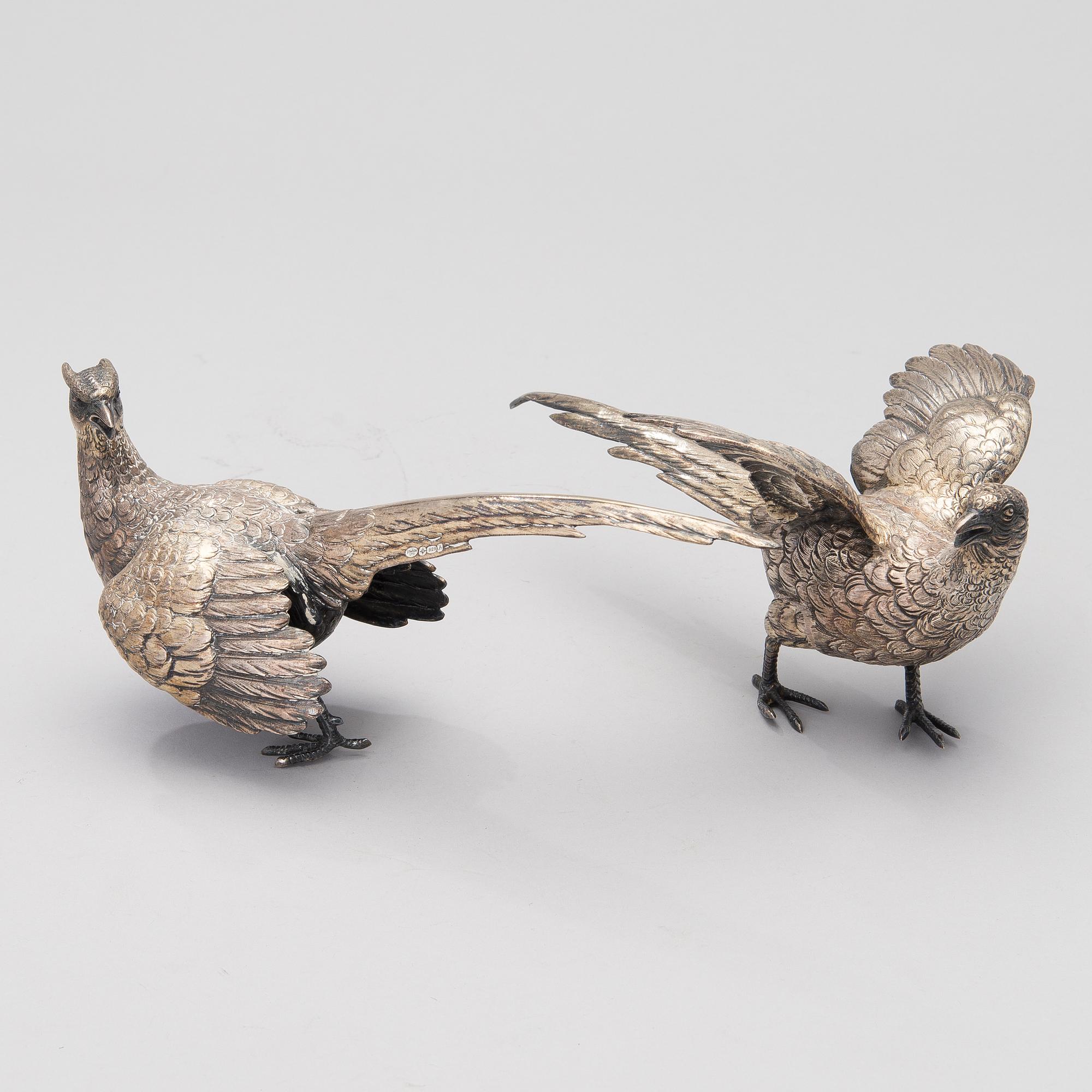 Two bird table decorations in silver, German and British hallmarks.