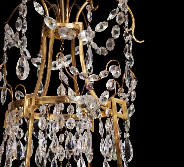 A German Louis XVI ormolu and cut-glass nine-light chandelier attributed to Johann Christoph Ermisch, late 18th century.