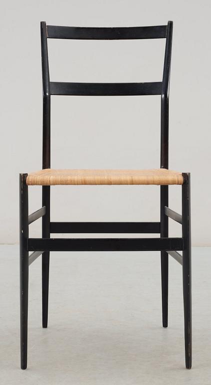A Gio Ponti 'Superleggera' chair, Cassina, Italy, black painted ash with ratten seat.