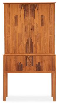A Carl Malmsten mahogany cabinet with inlays of different types of wood, signed and dated 1958.