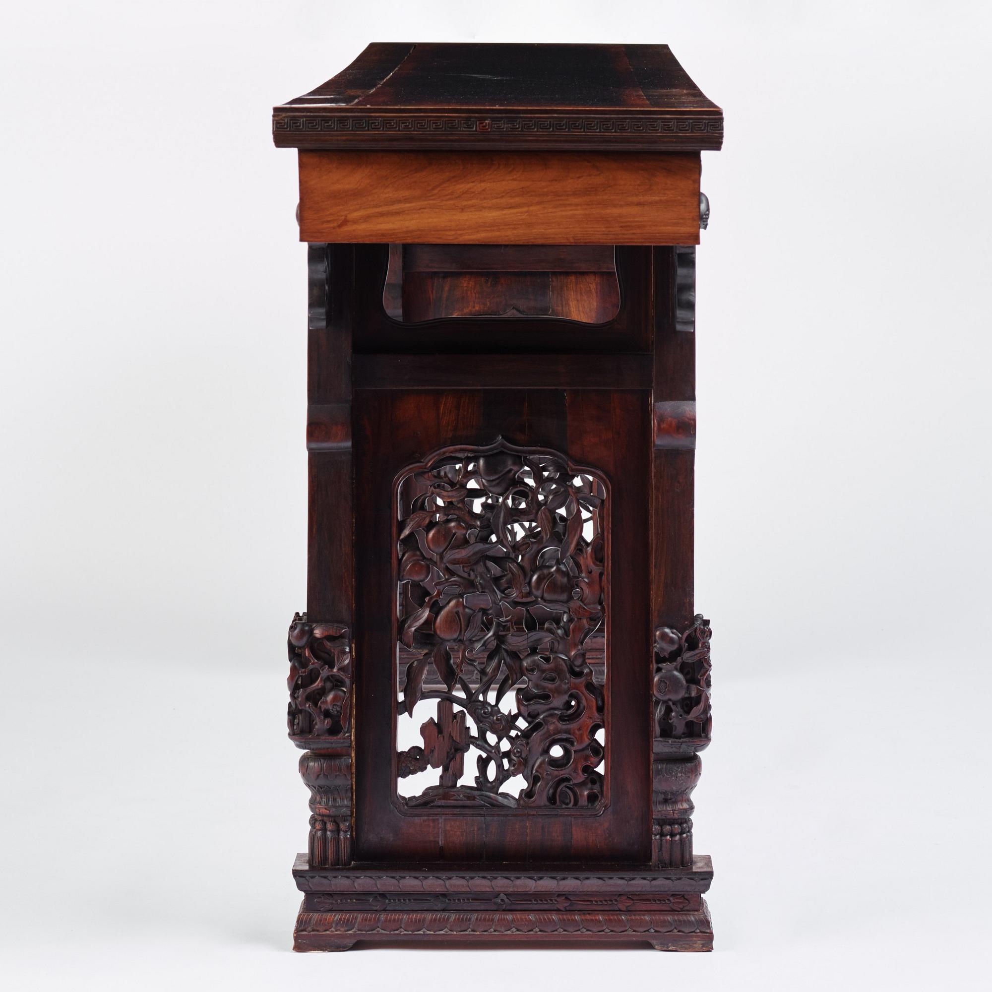 A massive zitan recessed-leg long table 'Jiaotousun Qiotouan', Qing dynasty, 19th century.