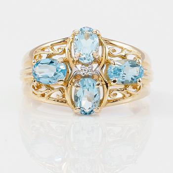 RING, 14K guld, blå topaser tot ca 2.40 ct. och mindre diamant.