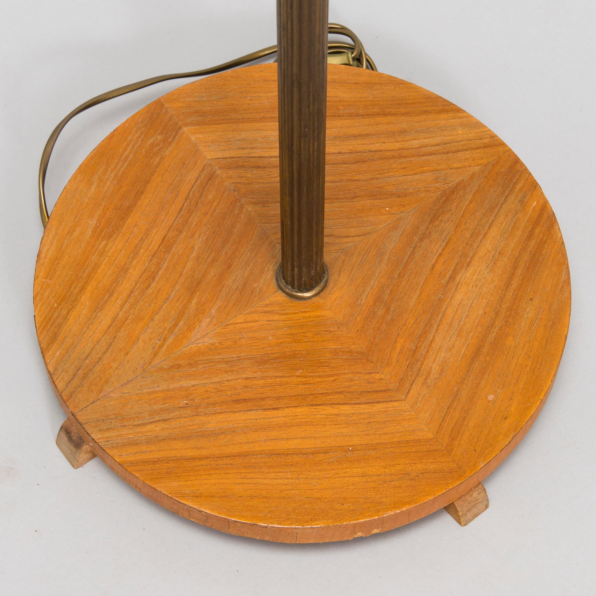 A brass floor lamp, mid-20th century.