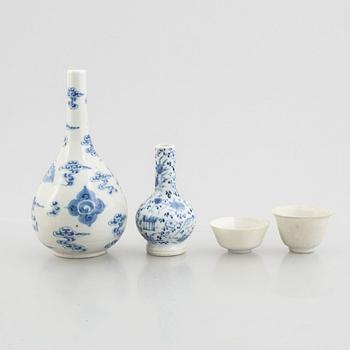 Two blue and white vases and two white glazed cups, China, late Qing dynasty and early 20th century.