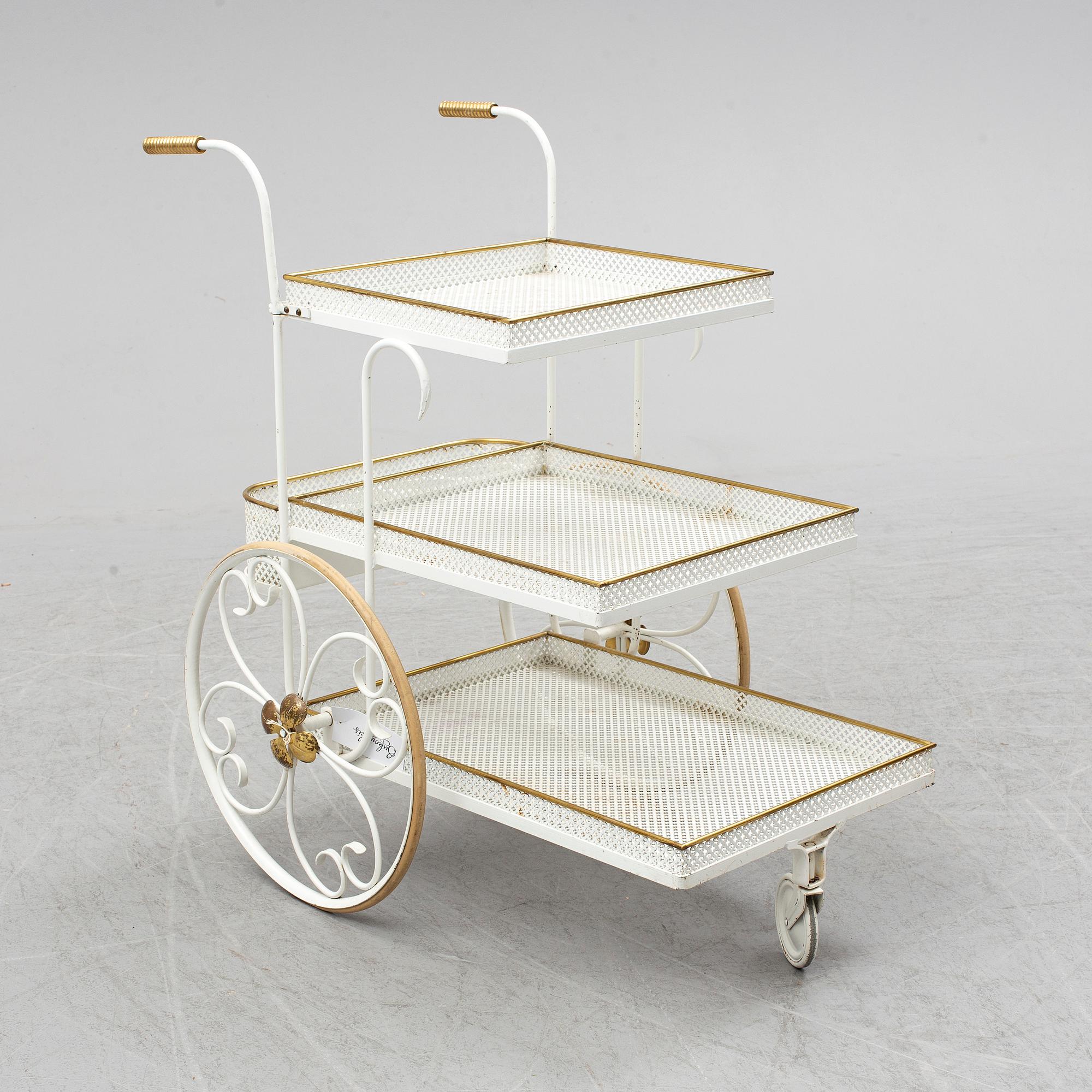 A white lacquered metal and brass serving trolley, 1940's-50's.