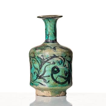 A Kashan turquoise blue-glazed ewer, central Persia (Iran), 11th to 12th century.