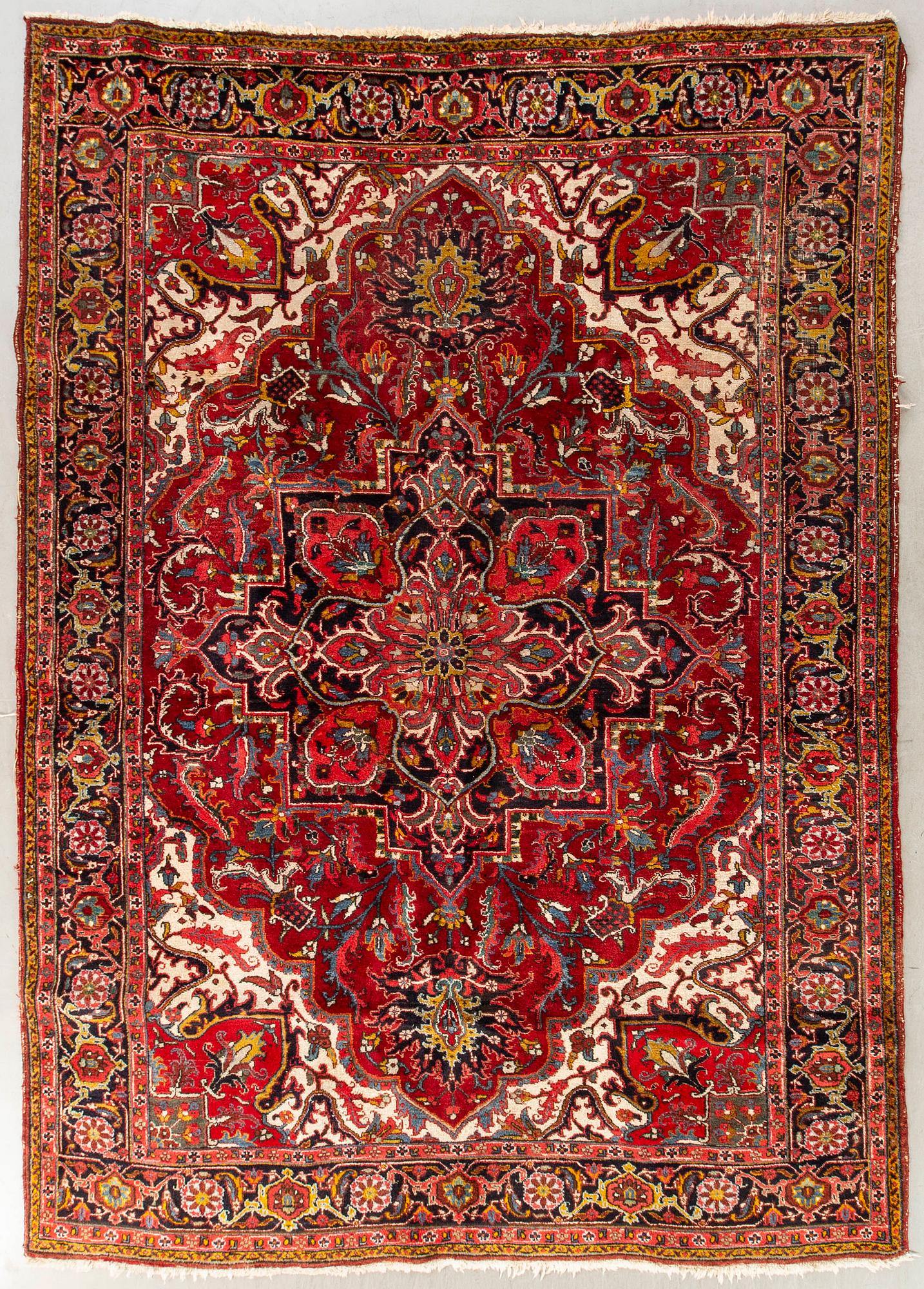 An old Heriz carpet ca 348 x 246 cm.