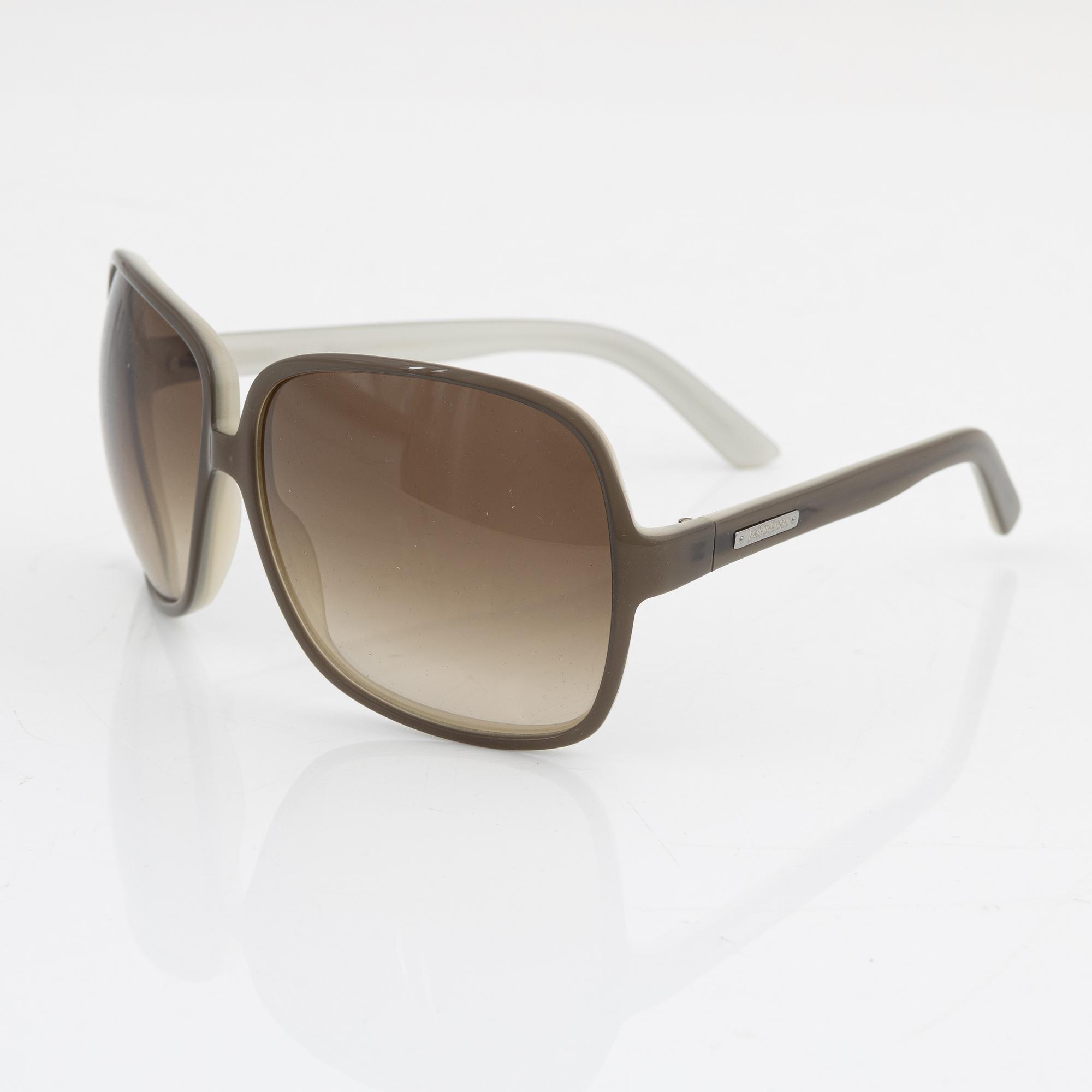 Yves Saint Laurent, a pair of grey plastic sunglasses.