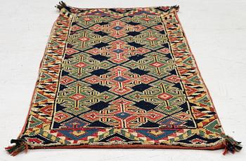 An embroidered carriage cushion, c. 98,5 x 41 cm, South West Scania, circa 1800-1830.