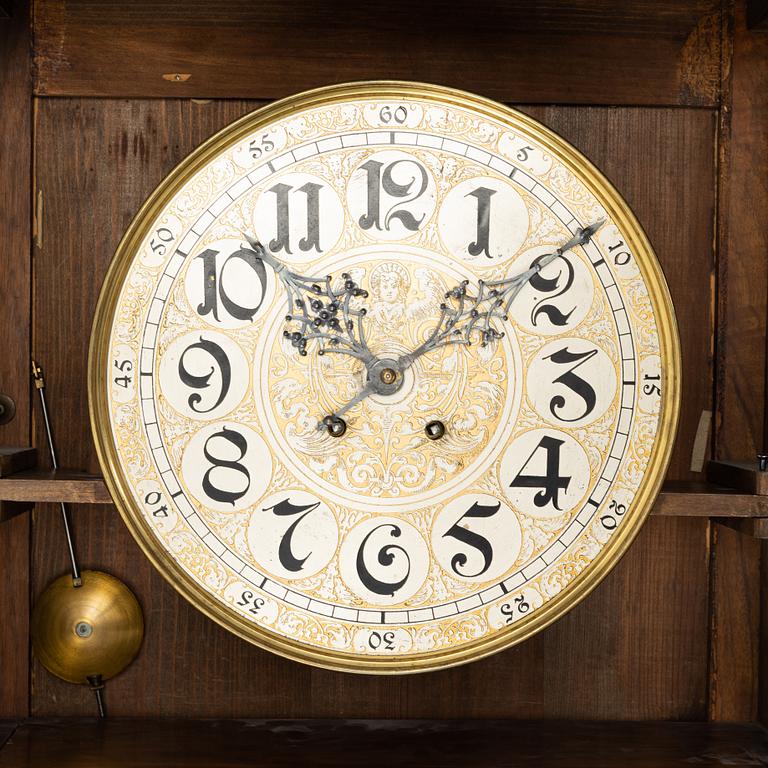A 19th Century wall clock.