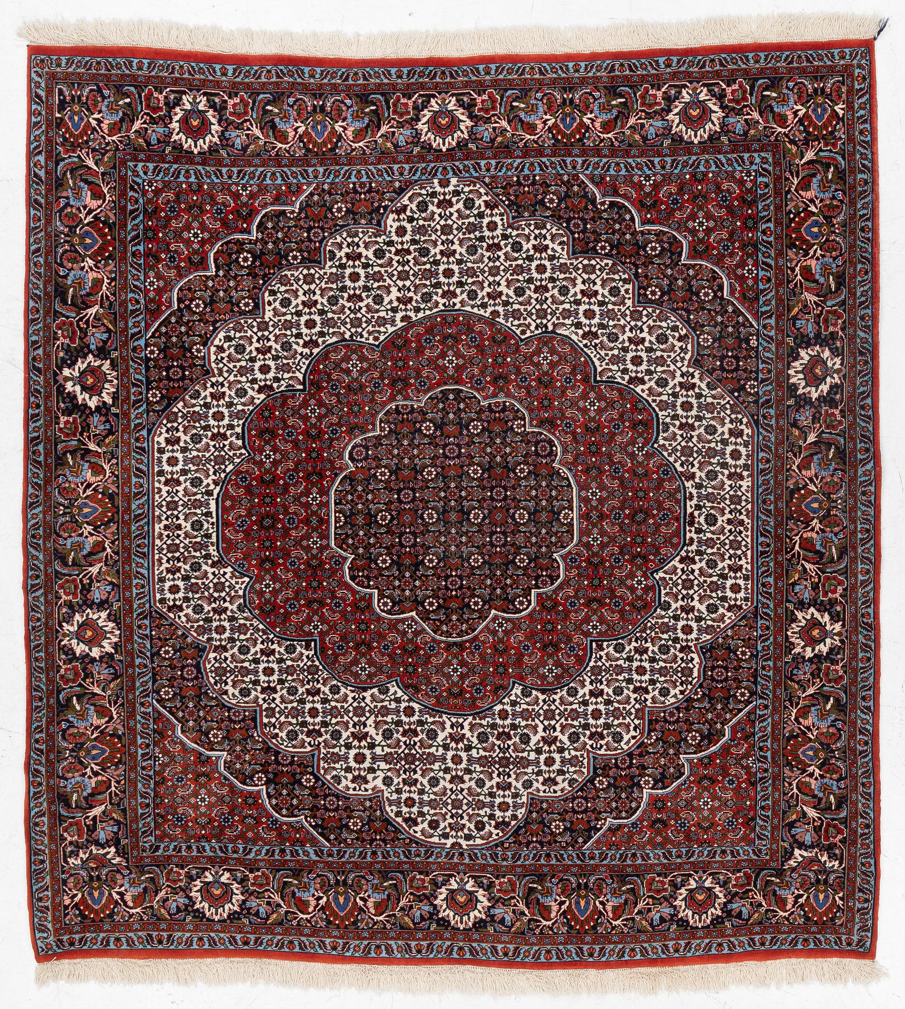 An Oriental rug, approx. 213 x 201 cm.