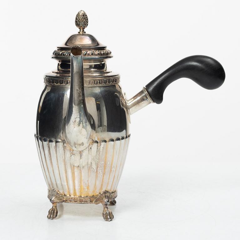 A Swedish silver coffee pot, cream jug and sugar box, Gustavian style, mark of AG Dufva, Stockholm 1911-1912.