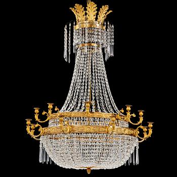 135. An ormolu and cut glass sixteen-branch Empire chandelier, Paris, early 19th century.
