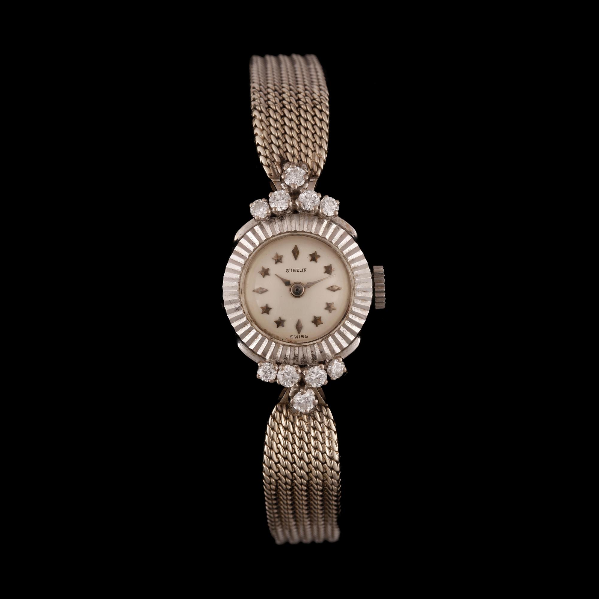 ARMBANDSUR, 18k vitguld med 10 briljantslipade diamanter, tot ca 0,3ct. "Gübelin". Total guldvikt ca 19 gram.