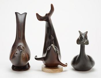 Three Gunnar Nylund stoneware figures, a dolphin, a pheasant and a great crested grebe, Rörstrand.