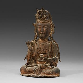 378. A seated bronze sculpture of Guanyin, late Ming dynasty.