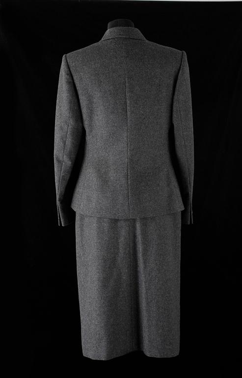 A two-piece grey wool costume consisting of jacket and skirt by Celine.