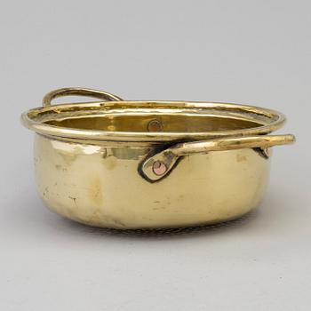 An 18th century brass colander.