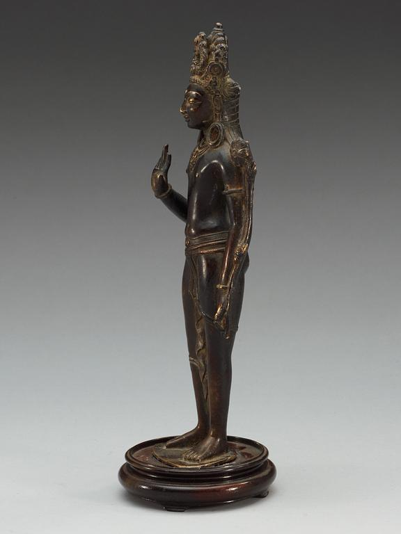 A Sino-Tibetan bronze figure of Padmapani, standing in slight tribhanga pose, 18th Century.