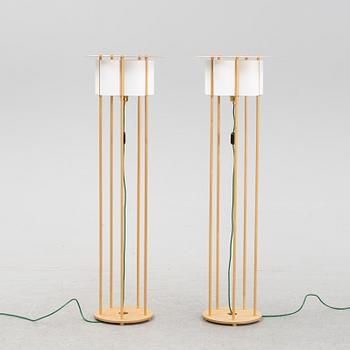 Torbjörn Ahlström, a pair of birch floor lights, dated 1993.