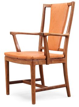 541. A Carl-Axel Acking walnut armchair, upholstered in light brown leather, Nordiska Kompaniet, Sweden, ca 1947.