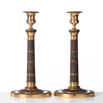 A pair of French Empire early 19th century candlesticks.