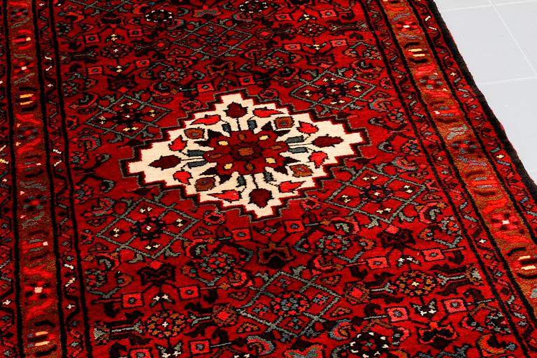 A Hosseinabad runner, 300 x 98 cm.