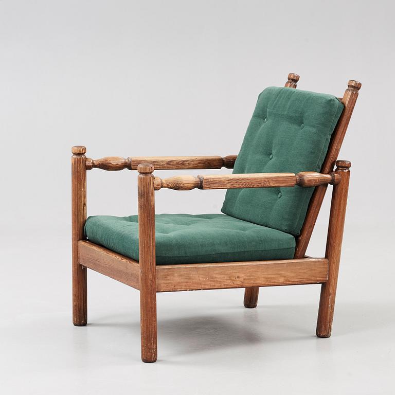 An Axel Einar Hjorth stained pine 'Sandhamn' armchair, Nordiska Kompaniet 1929.