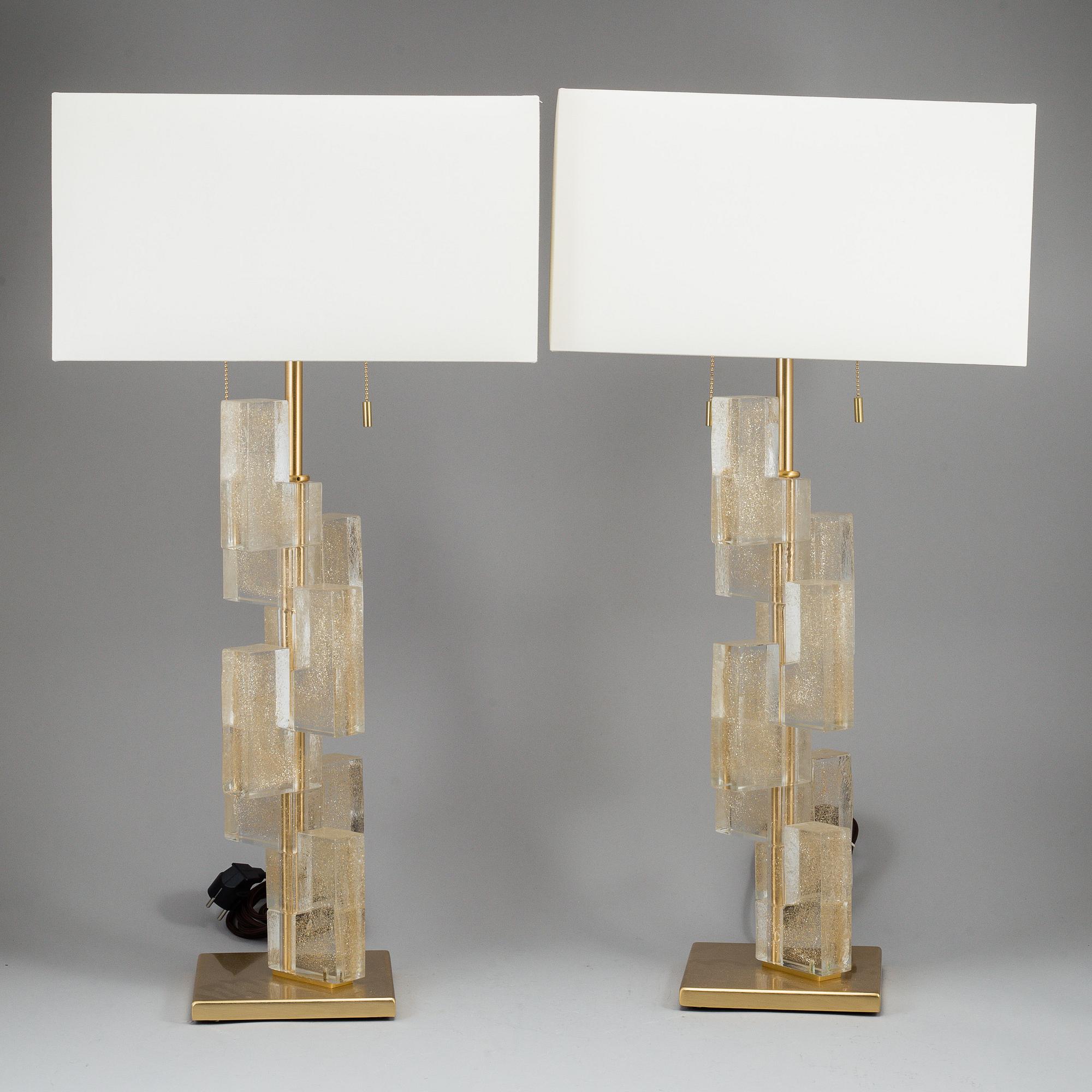 A 'Esha Alta' glass and brass table lamp from Donghia lightning.