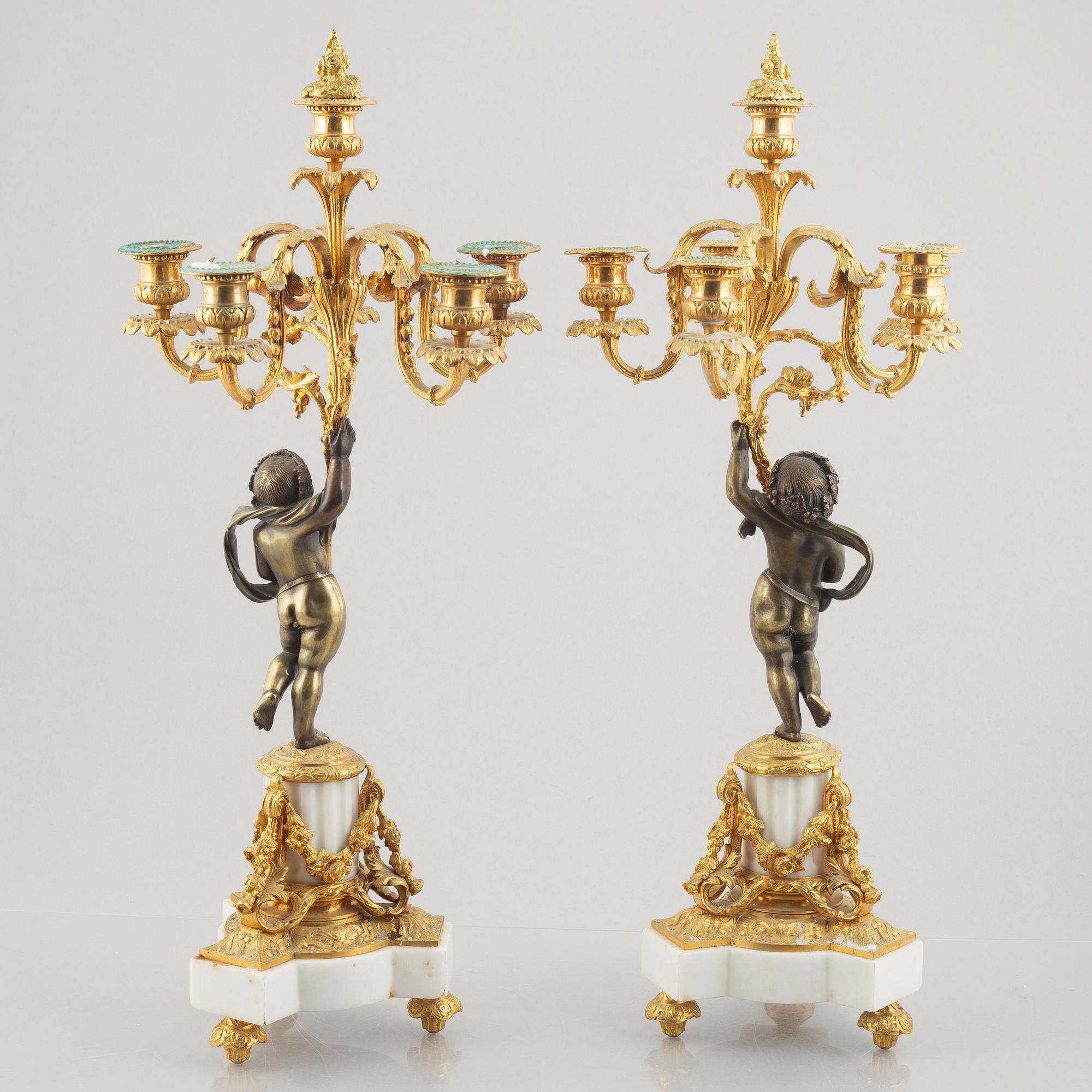 A pair of bronze and marble candelabra, possibly France, late 19th century.