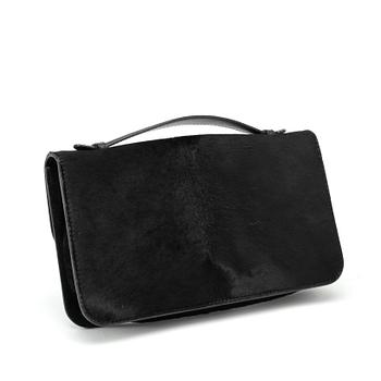 ALEXANDER MCQUEEN, a black pony hair clucth bag.