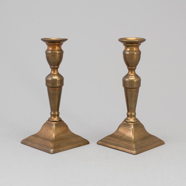 A PAIR OF BRONZE CANDLESTICKS, first half of the 19th century.